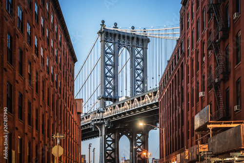 Fototapeta Naklejka Na Ścianę i Meble -  Dumbo - The famous Manhattan bridge between two red brick buildings in Brooklyn - New York City, NY