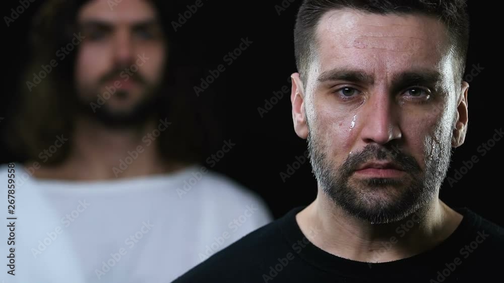 Jesus in robe putting hand on crying man head and shoulder, healing from illness Jesus in robe putting hand on crying man head and shoulder, healing from illness