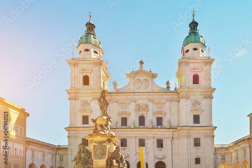 Famous Salzburg Cathedral, Salzburger Dom, at Domplatz in City Center of Salzburg Land, Austria on sunny day. Baroque roman catholic church and Marien Statue monument on square Beautiful architecture. photo