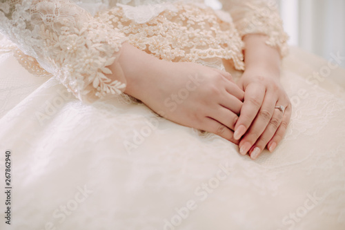 Wedding ring in finger of the bride.