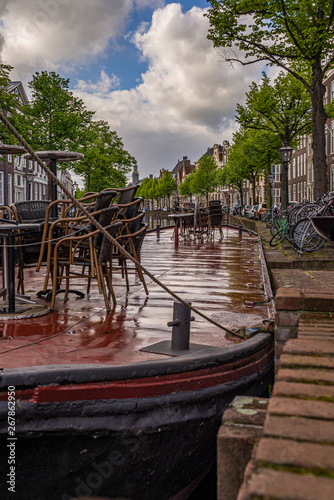 Empty restaurant on the barge right after heavy rain