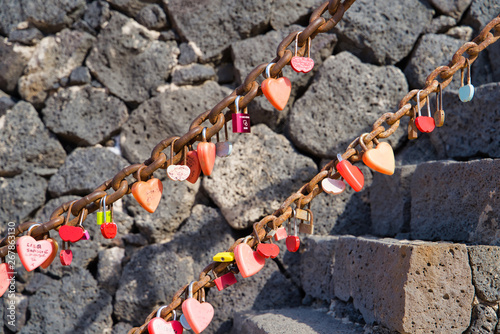 Old stone tower / wedding locks on the railing of the stairs, Lanzarote, Canary Islands, Spain