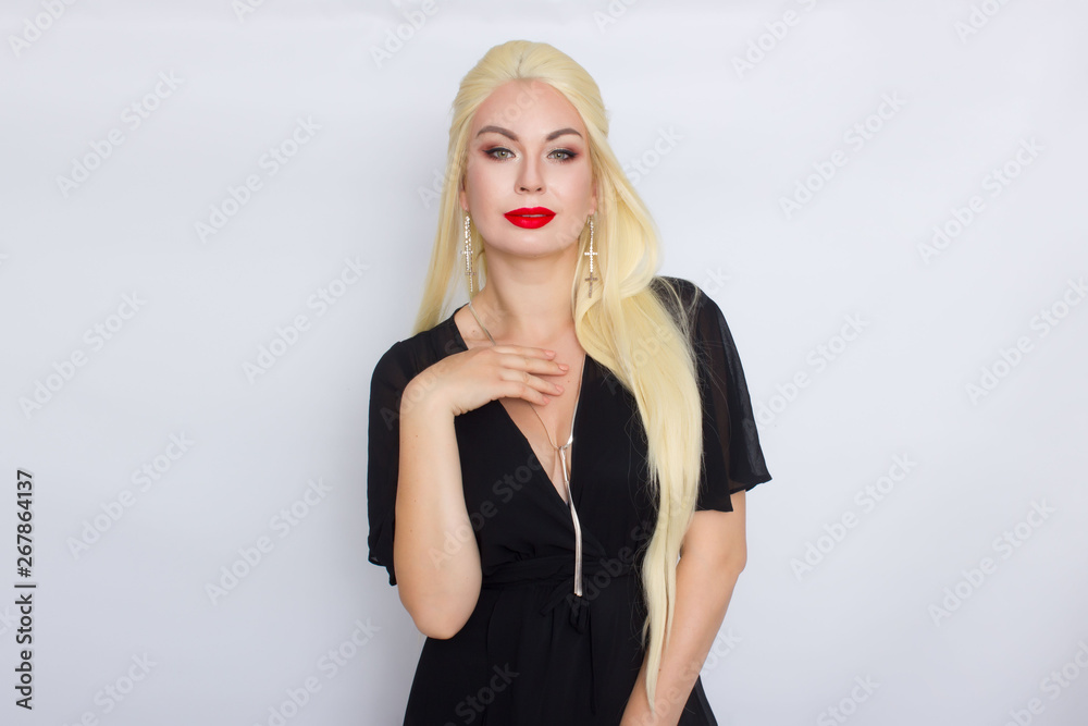 Blonde woman with brigh makeup wearing black evening dress Blonde woman with brigh makeup wearing black evening dress