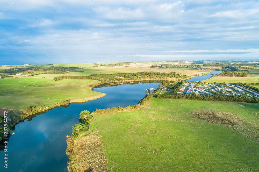 Aerial view of Hopkins River and Holiday Park at sunset in Warrnambool, Australia
