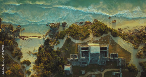Top birds-eye view of ancient Maya sun temple in Tulum, Mexico shot by drone