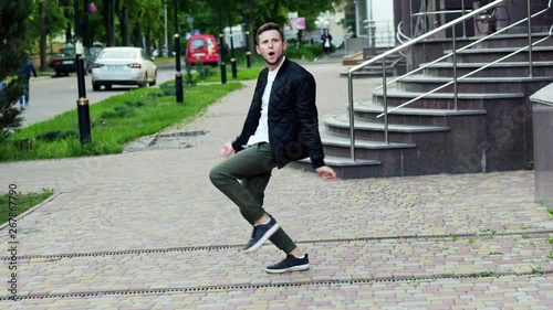 Crazy funny man dancing on the street, very pleased, winning concept