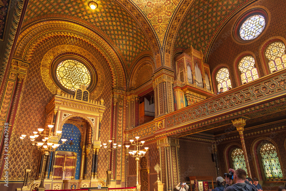 Remarkable beautiful golden interior view of Spanish Synagogue, influenced by moorish interior design in Alhambra, at Jewish Town in Prague, Czech Republic.