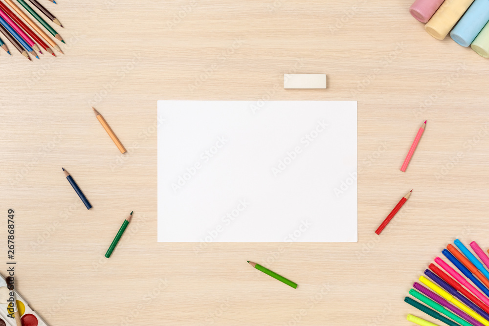 Creative hobby. Desk top view no people paper sheet surrounded by stationery