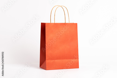 Orange shopping bag isolated on white background.