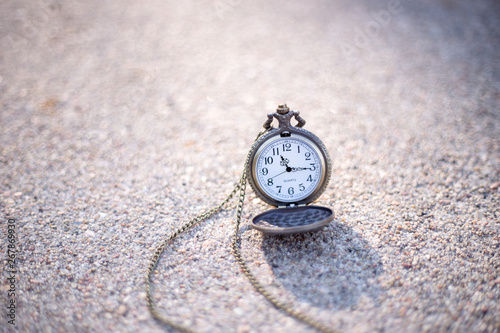 old pocket watch on grunge background