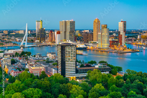 Sunset aerial view of Erasmus bridge and skyline of Rotterdam, Netherlands photo