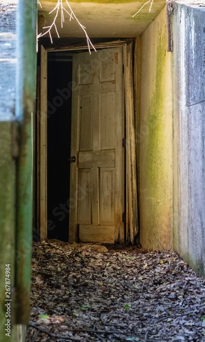 Creepy scary door leading into dark room 