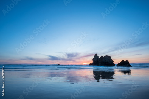 Landscape Picture of Sunset in the Oregon Beach With Large Rocks just offshore