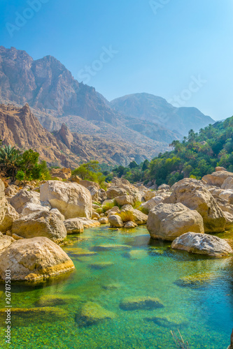 Lagoon with turqoise water in Wadi Tiwi in Oman. photo