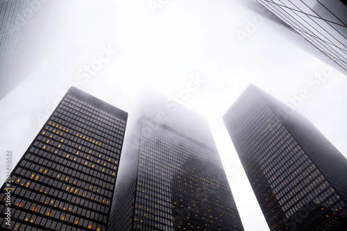 Canvas Print Looking up the Toronto financial district in city downtown with misty sky