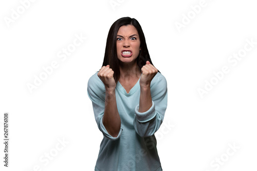 Obraz na płótnie Woman with extreme rage, clinched fists and jaw, angry, emotional, and furious,