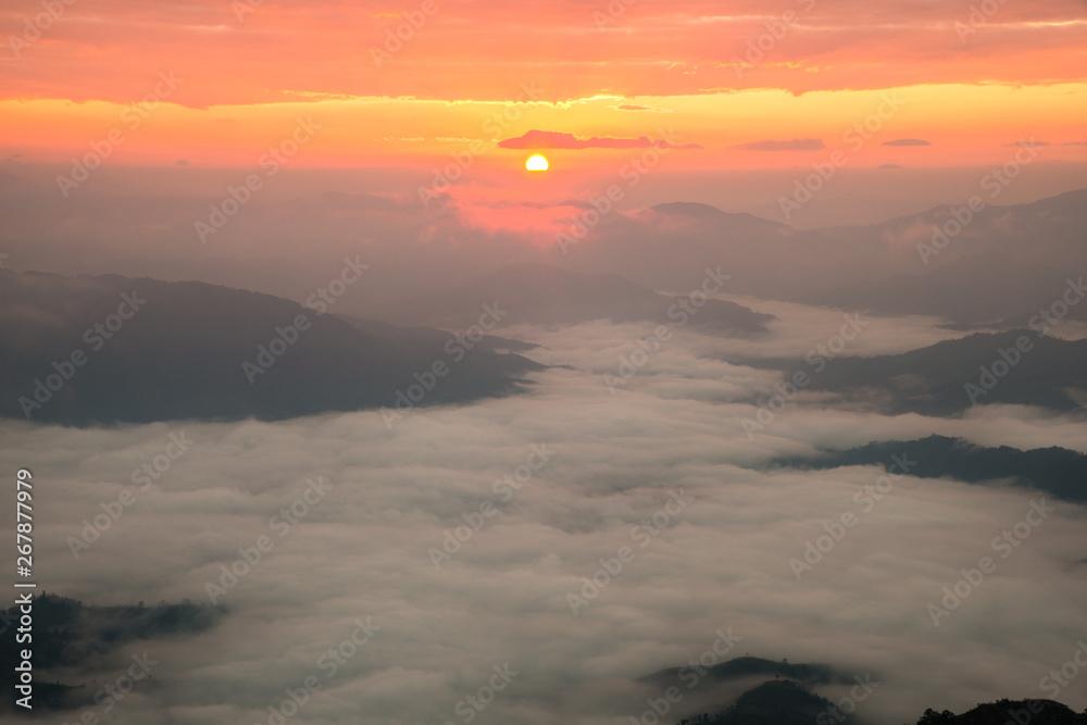 Beautiful sunrise over highland mountains view from Phu Chi Dao located in Chiang Rai province of Thailand. Winter landscape in Northern region of Thailand.