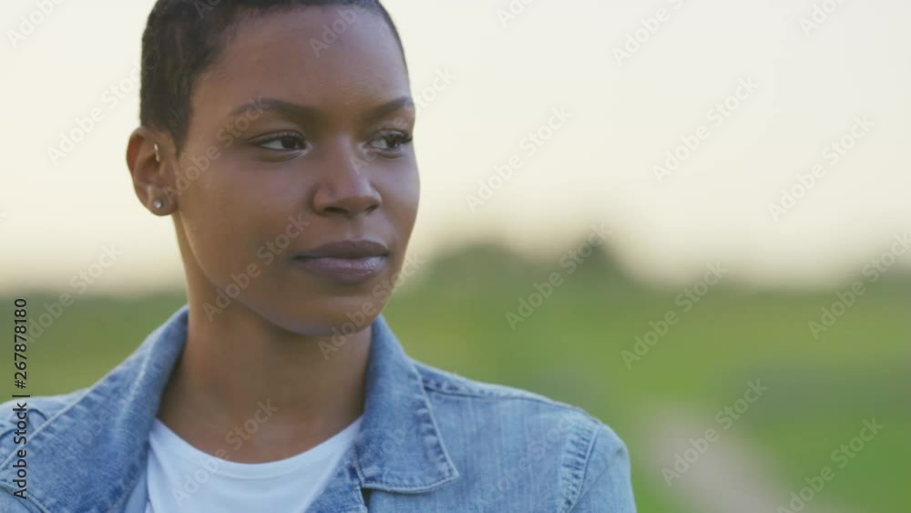 Portrait of young black female looking off camera, in slow motion Portrait of young black female looking off camera, in slow motion