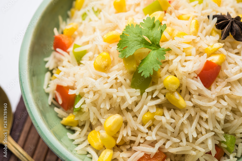 Corn Pilaf or Pulav made using boiled Maize seeds with rice and vegetables. selective focus Corn Pilaf or Pulav made using boiled Maize seeds with rice and vegetables. selective focus