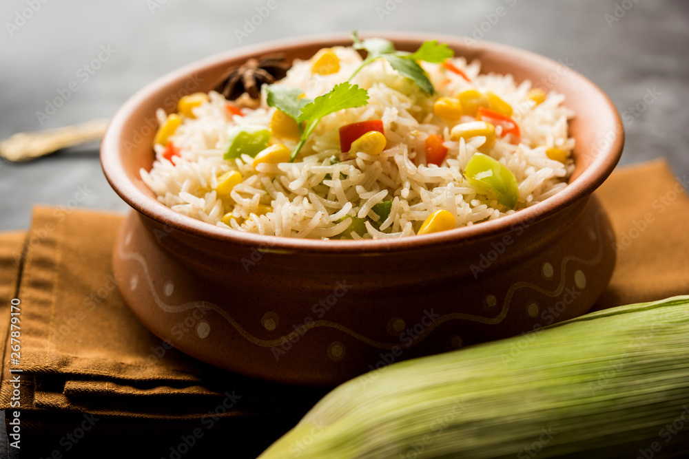 Corn Pilaf or Pulav made using boiled Maize seeds with rice and vegetables. selective focus Corn Pilaf or Pulav made using boiled Maize seeds with rice and vegetables. selective focus