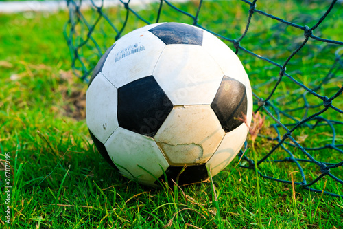 Soccer ball in green field, Soccer ball on grass, vintage style,copy space © mrspopman