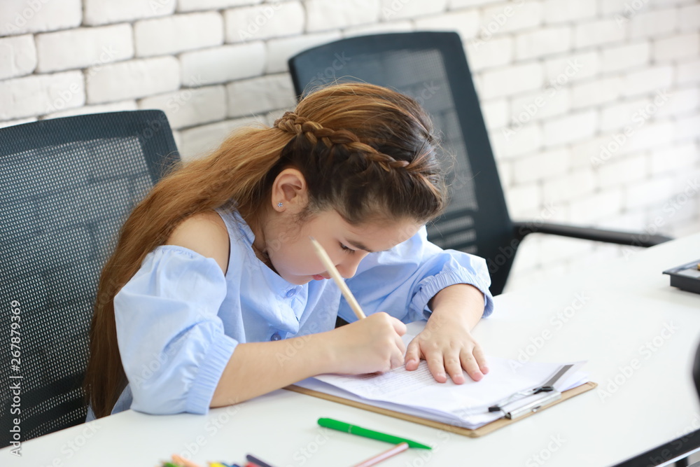 smart school girl drawing in class (education concept) smart school girl drawing in class (education concept)