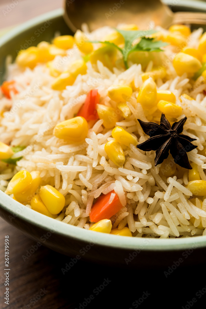 Corn Pilaf or Pulav made using boiled Maize seeds with rice and vegetables. selective focus Corn Pilaf or Pulav made using boiled Maize seeds with rice and vegetables. selective focus