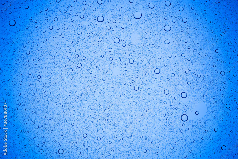 Rain droplets on blue glass background, Water drops on blue glass. Rain droplets on blue glass background, Water drops on blue glass.