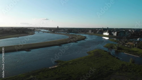 Wallpaper Mural Aerial shot of idyllic city skyline with church and bridge besides a river Torontodigital.ca