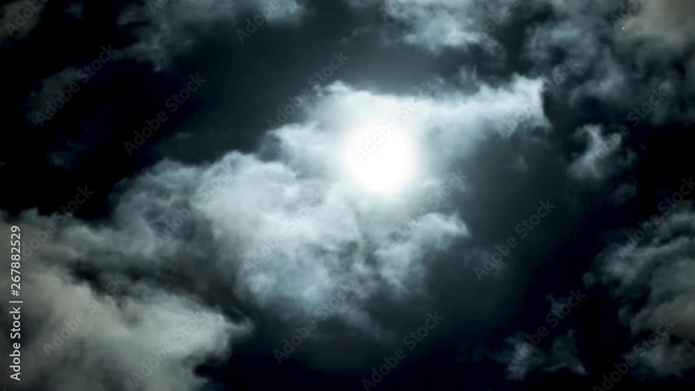 Romantic full moon on night blue sky on cloudy day. Bright white moon between volume cumulus clouds. Romantic full moon on night blue sky on cloudy day. Bright white moon between volume cumulus clouds.