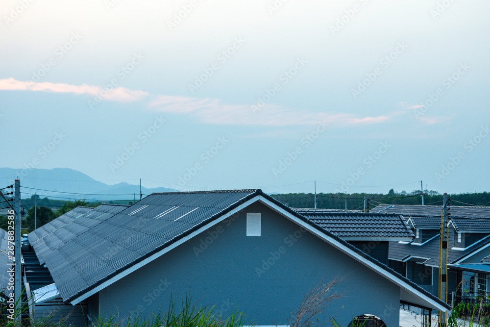 Top view roof of modern village with sunset sky, New modern town home style, Beautiful house in dawn sky, Born of new home village show of expansion of business background concept