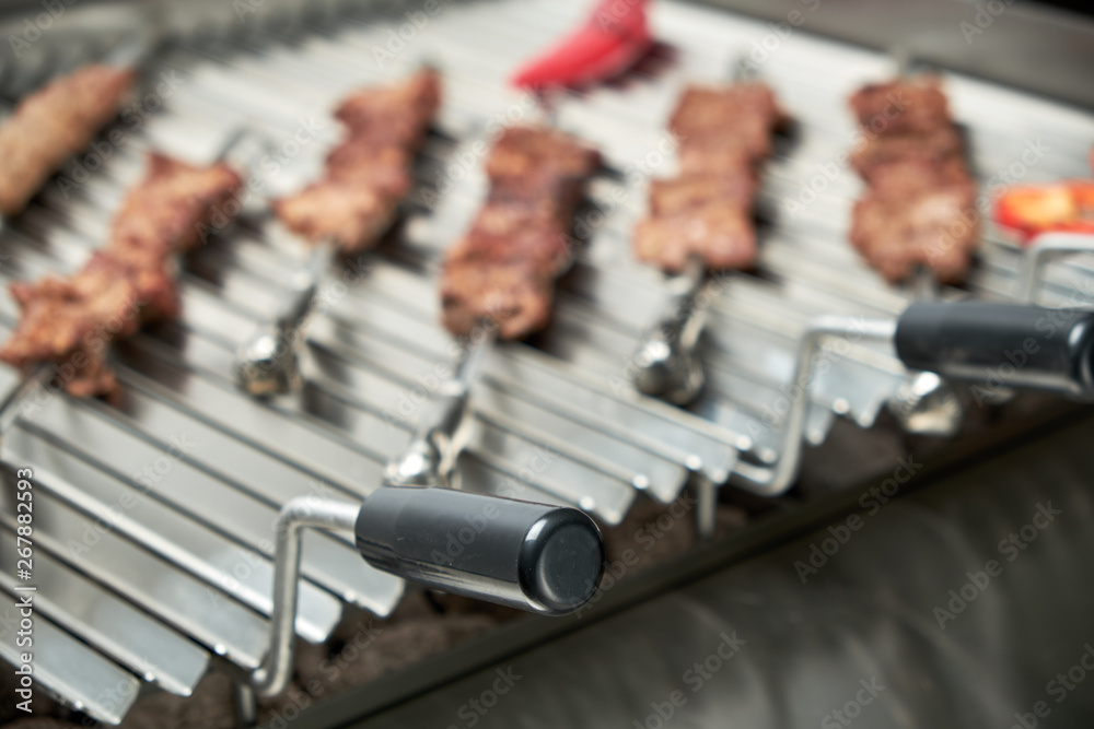 Naklejka premium Kitchen electric grill with stones for the network catering. Professional kitchen equipment