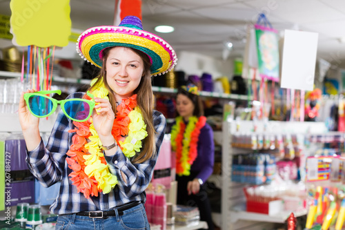  girl choosing for things in store of festival outfits