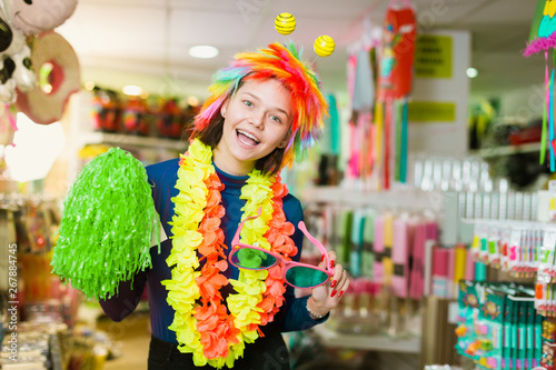 Female having fun in festival outfits store