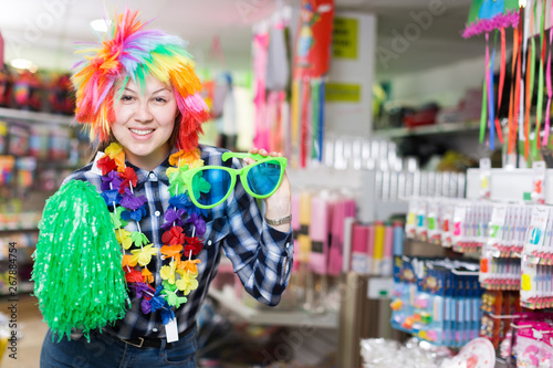 Girl in store of festival accessories