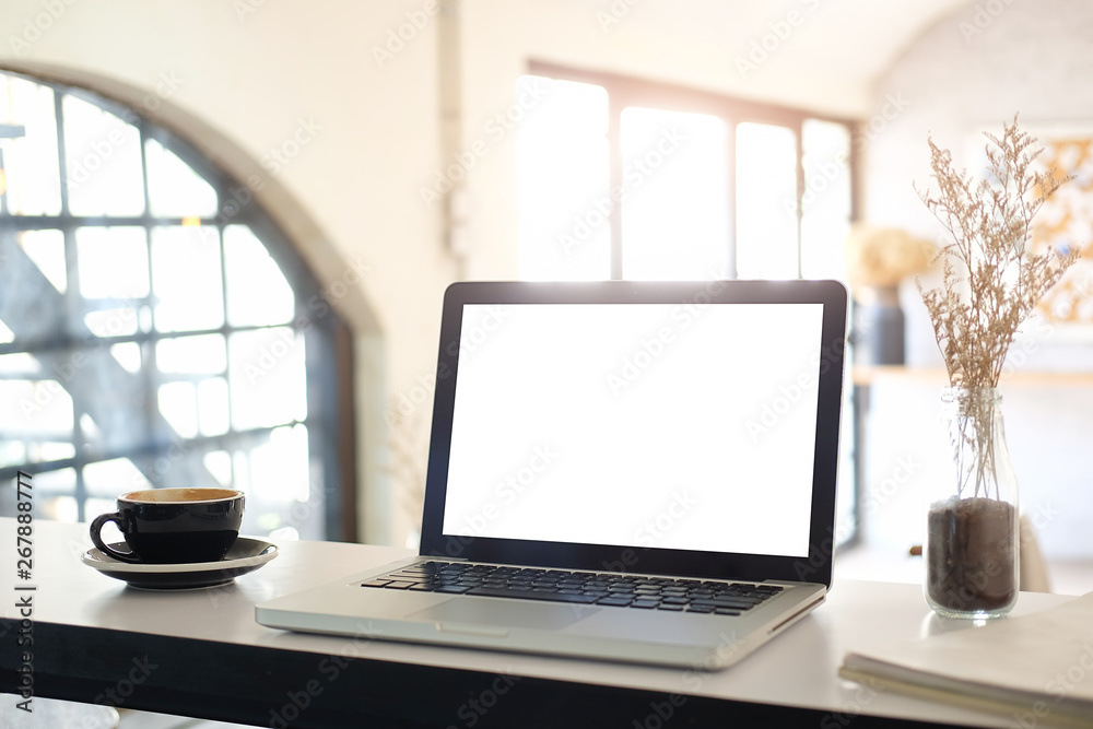Fototapeta premium Mock up Copy Space Blank Screen workspace with computer laptop on table.