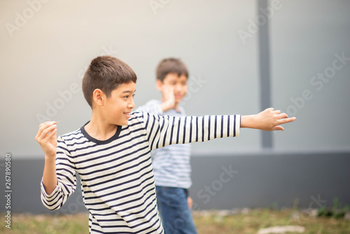 Little boy playing darts board family outdoor activity