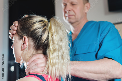 The visceral doctor is engaged in manual editing of the skull of a young girl. Alternative medicine. Health Prevention Concept