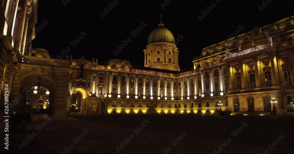 Dolly shot of the illuminated Buda Castle at night in Budapest. Dolly shot of the illuminated Buda Castle at night in Budapest.