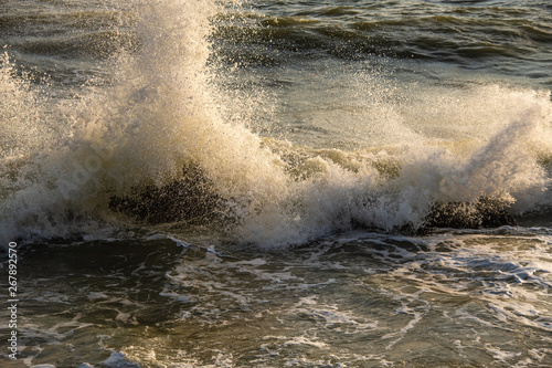 Splashing wave on the sea in morning
