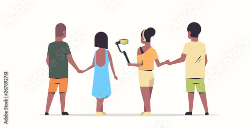 people group using selfie stick african american men women taking photo on smartphone camera friends having fun male female rear view cartoon characters full length flat white background horizontal