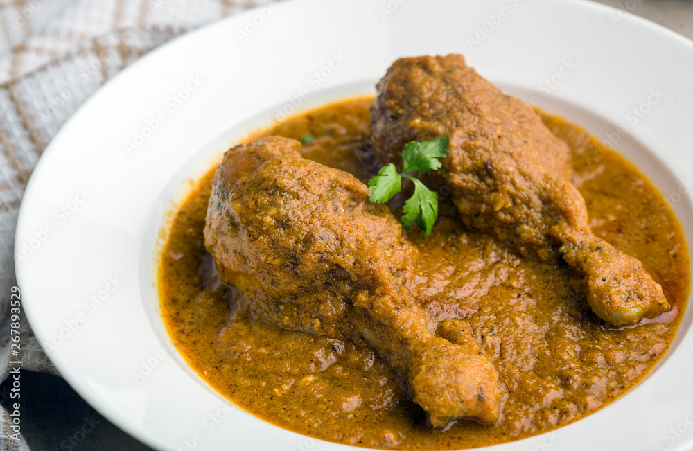 authentic chicken gravy served in a plate for lunch authentic chicken gravy served in a plate for lunch