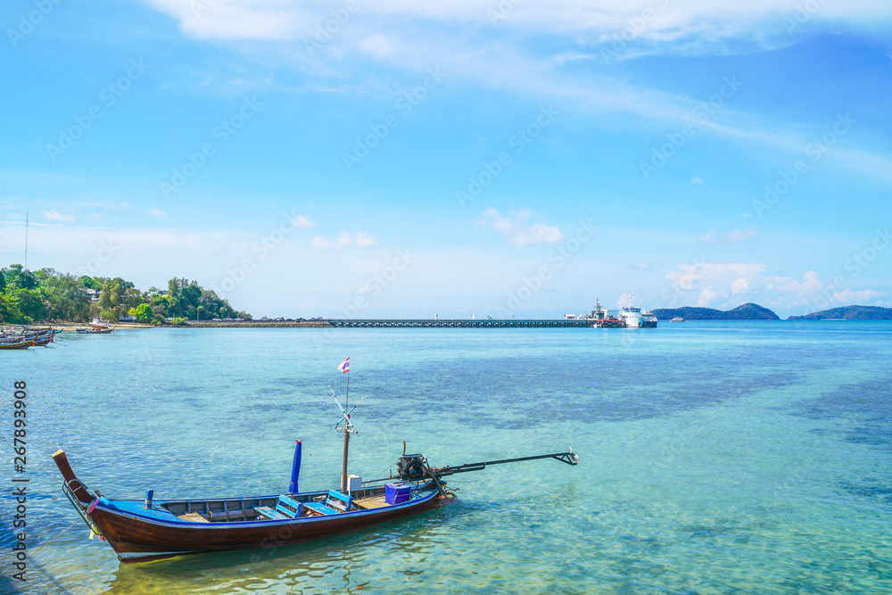 boat floating on turquoise sea with bright blue sky in Phuket province, Thailand boat floating on turquoise sea with bright blue sky in Phuket province, Thailand