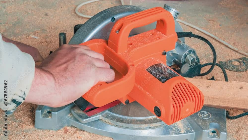 Carpenter Using Circular Saw for Cutting Wooden Boards Carpenter Using Circular Saw for Cutting Wooden Boards