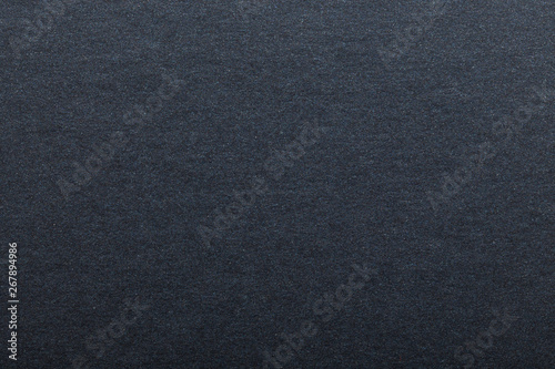 Texture of dark paper. Background for images. copyspace. space for text. sheet of gray craft paper as background. black paper