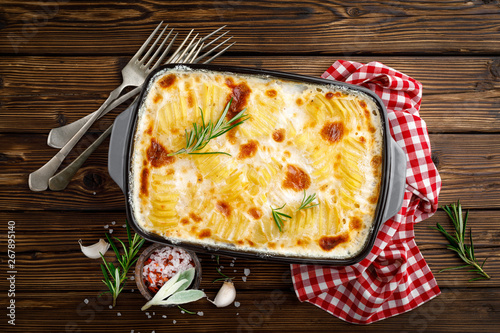 Potato gratin. Baked potato with cream, cheese and garlic