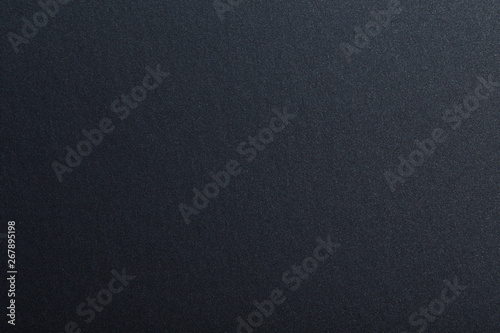 Texture of dark paper. Background for images. copyspace. space for text. sheet of gray craft paper as background. black paper