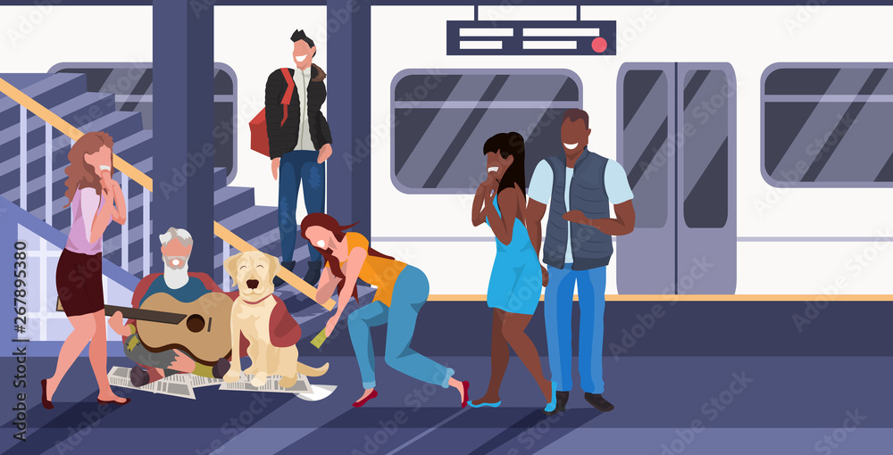 beggar sitting with dog train subway railway underground station mix race passengers giving money to beggar man playing guitar homeless jobless concept horizontal full length