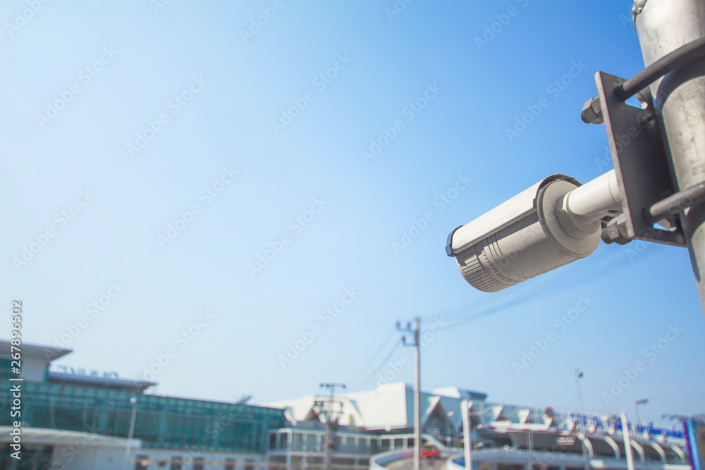 Closed-circuit television,Security CCTV camera or surveillance system in background of International Airport ,Passenger Terminal taxi ,Tropical zone color