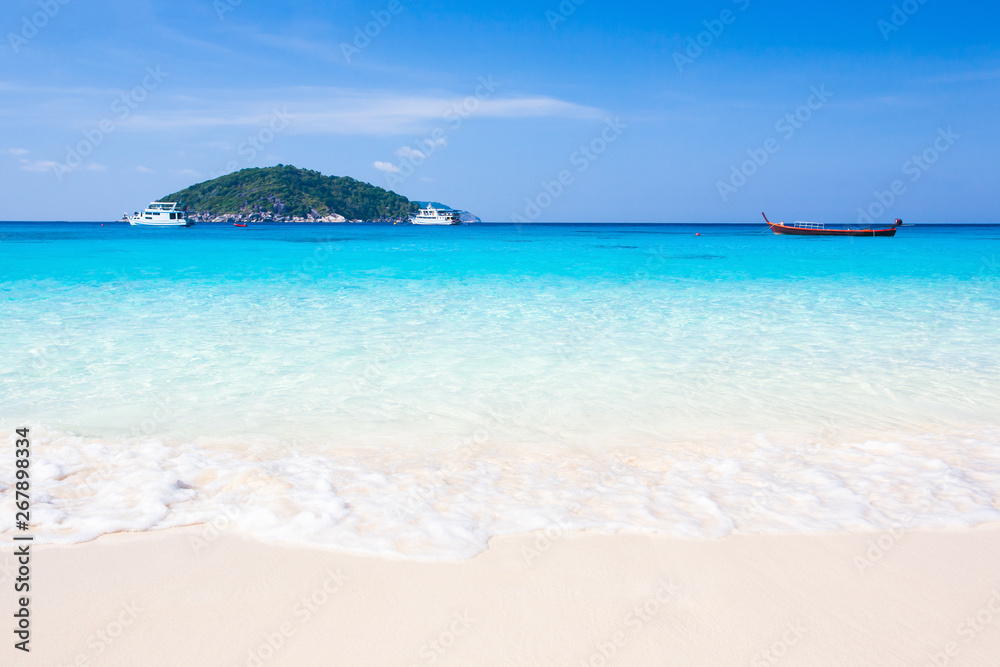 Bright tropical beach and turquoise seawater in summer.